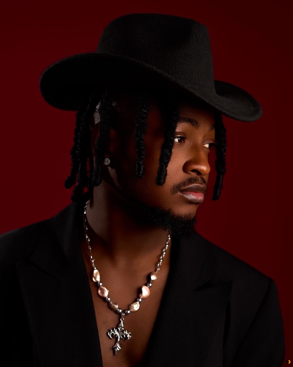 SULTEX, BBNaija Season 11 housemate, in a black hat and blazer